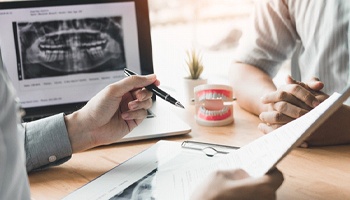 A dentist discussing a patient’s oral health