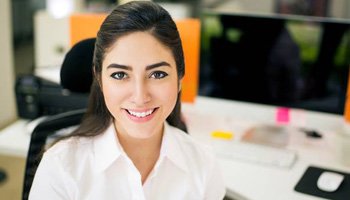 Smiling woman at desk