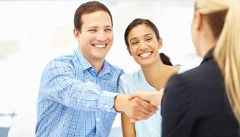 Smiling man and woman in a consultation