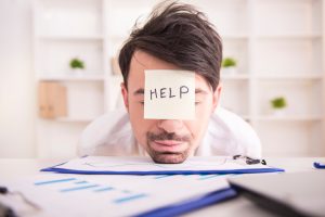 Man falling asleep at work