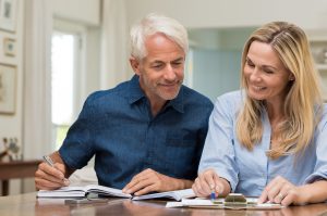 Man and woman discussing insurance paperwork