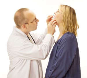 Doctor checking fit of oral appliance